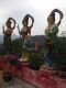 Three_more_female_Bodhisattvas_by_the_Kwun_Yam_Temple_with_The_Pagoda_on_the_lower_level_in_the_distance.jpg